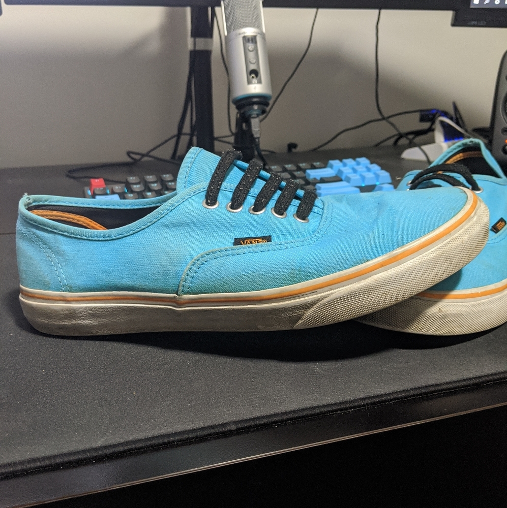 Cyan colored lowtop vans